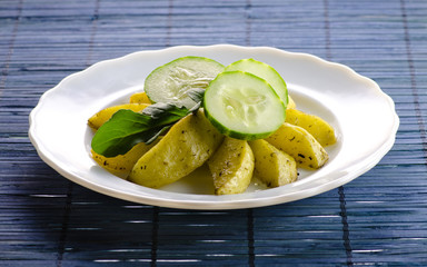 Baked potatoes with fresh cucumbers