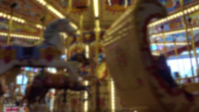 Blurry background of moving carousel