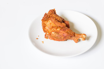 crispy  fried chicken in  the white dish on a wooden table , close up delicious fried chicken , close up