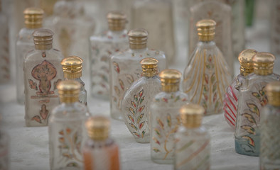 Fototapeta na wymiar Small glass bottles for sale. Market in India
