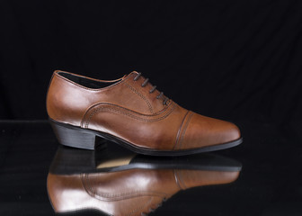 Male Brown Shoe on Black Background, Isolated Product, Top View, Studio.