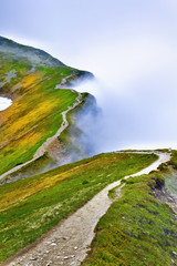 Beautiful view of path in foggy Tatra mountain.