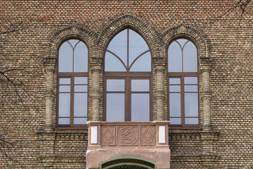 facade of administrative building with windows and a balcony