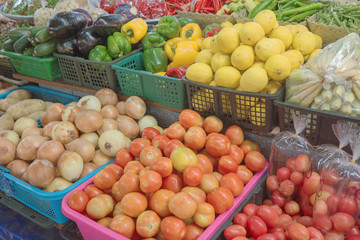 Vegetables and fruits in the baskets in a Thai market