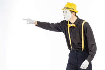 Portrait of a man, an artist, a pantomime. Shows something, isolated on white background