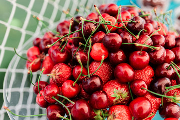 delicious buffet table with pastries, sweet cream, strawberry and cherry 