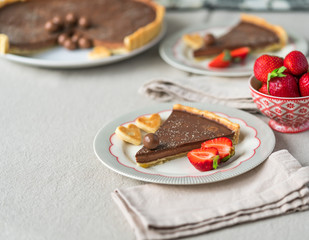 chocolate tart, heart shape short bread biscuits, strawberries on desert.