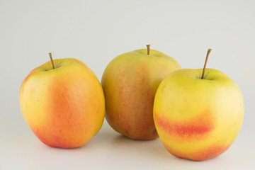 Three apples on a white background