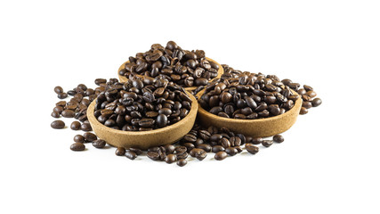 Preparing fresh roasted coffee beans in small wooden bowl on white background.