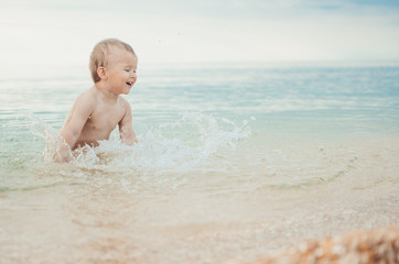 little boy swimming in sea