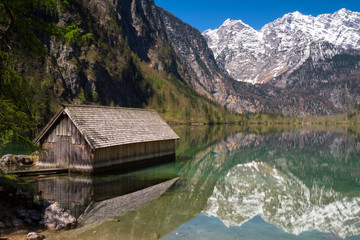 Fototapeta na wymiar Boat house on lake Obersee with beautiful reflections