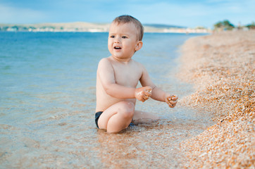 A child sitting in the sea