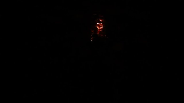 Wall lamp flickering in the dark