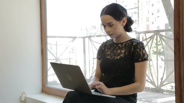 Pretty girl working on laptop 02