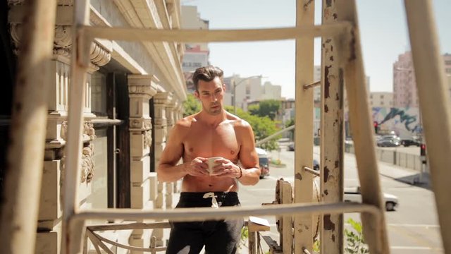 Shirtless man coffee balcony 01