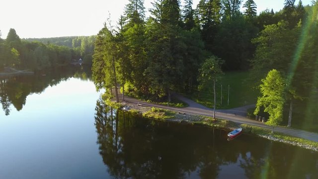 View of a lake in germany flying above with nice view on the trees. Ebnisee, slow camera move