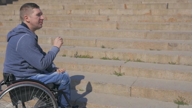 Steps for wheelchairs, Disabled man in wheelchair Can not overcome obstacle, invalid person on wheel chair stuck, Difficulties movement people with disabilities, handicapped makes failed attempt