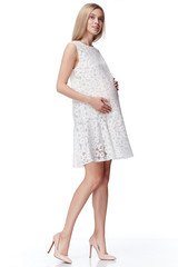 Beautiful elegant pregnant woman blond hair wear style fashion dress for mother hold in hand tummy wait for baby child new born pretty lady clothes for pregnancy white background collection heath.
