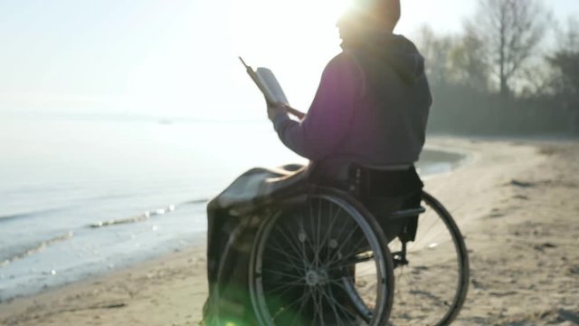 prays disabled person, sick person holds bible in hands, faith Hope, an invalid in wheelchair with holy book, handicapped asks help from God, man with disabilities reads holy scripture, disease
