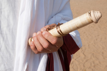 Ancient Roman book in hand