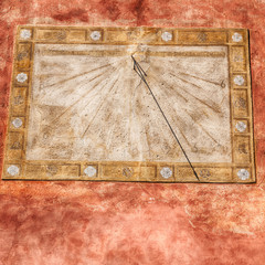 in italy sundial and   antique  wall