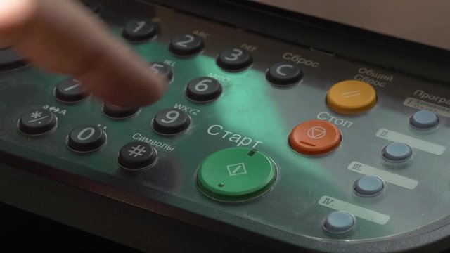 Man Finger Dials The Numbers On MFP