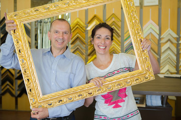 happy couple found an antique of gold photo frame