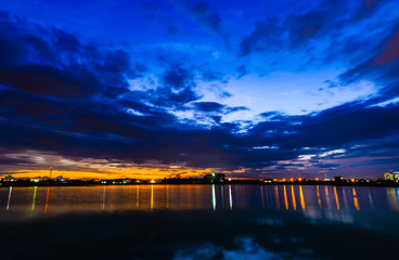 Fototapeta premium Long exposure view dam and city on sunset,vivid,blurry