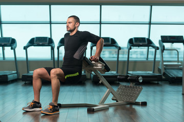 Man Doing Exercise For Triceps On Roman Chair