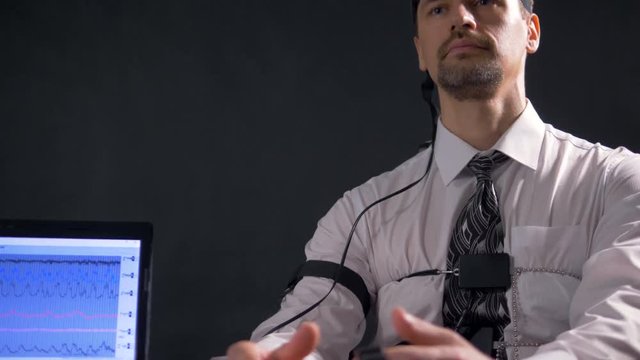 A male subject face when he answers polygraph questions. 4K 60 fps.