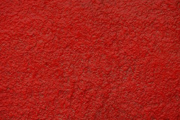 яркий красный фон из части бетонной стены здания