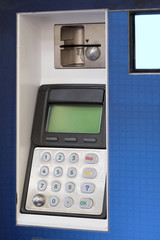 The image of a cash machine close up