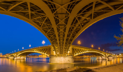 Budapest, Hungary - Panoramic shot taken under the famous Margaret bridge at blue hour