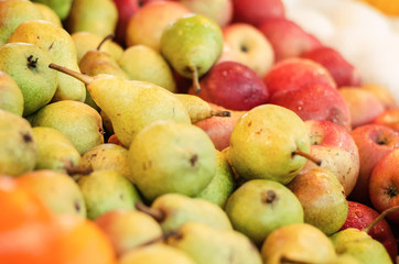 beautiful color combination, variety of fresh raw fruits background display at market stall.
