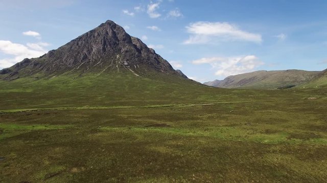 aerial footage approaching buchaille etive mor near glencoe in scotland during a scottish sunny summer afternoon