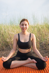 Fototapeta na wymiar Beautiful asian woman play yoga in the forest in the evening