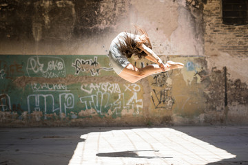 Pretty ballerina jumping and performing