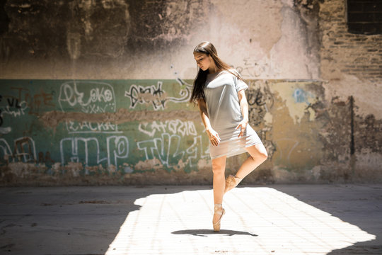 Gorgeous ballet dancer in urban setting