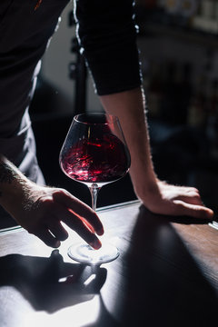Fototapeta Man tasting new sorts of wine at the table