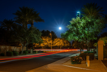 Full moon with car light trails