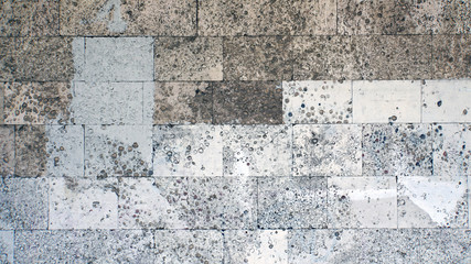 Fossiliferous limestone. Brick wall. Background and textures photography.