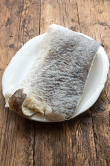 Slice of raw salted codfish