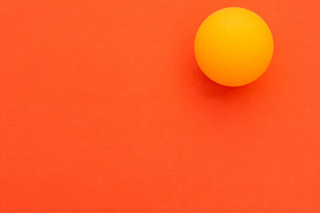 yellow tennis ball on a red background