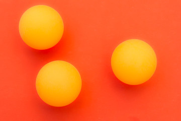 yellow tennis ball on a red background