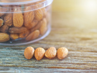 almond seeds on wooden background