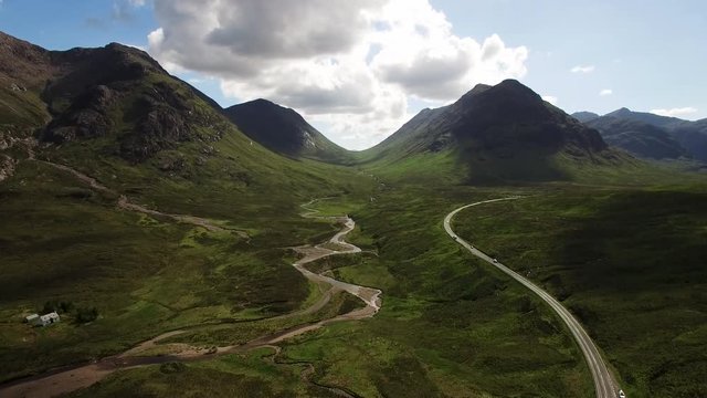 timelapse footage of the main road through glencoe during a scottish sunny afternoon in summer looking towards the pass to glen etive