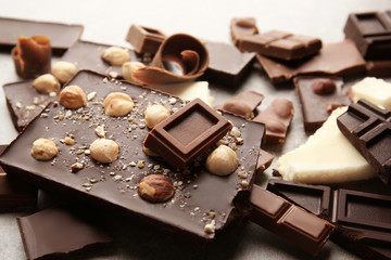 Heap of broken chocolate pieces on table