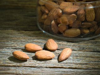 almond seeds on wooden background