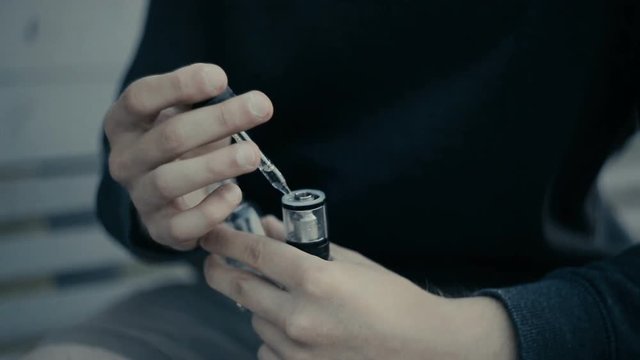Guy spews liquid in a vape