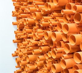 Fototapeta na wymiar PVC pipes stacked in construction site